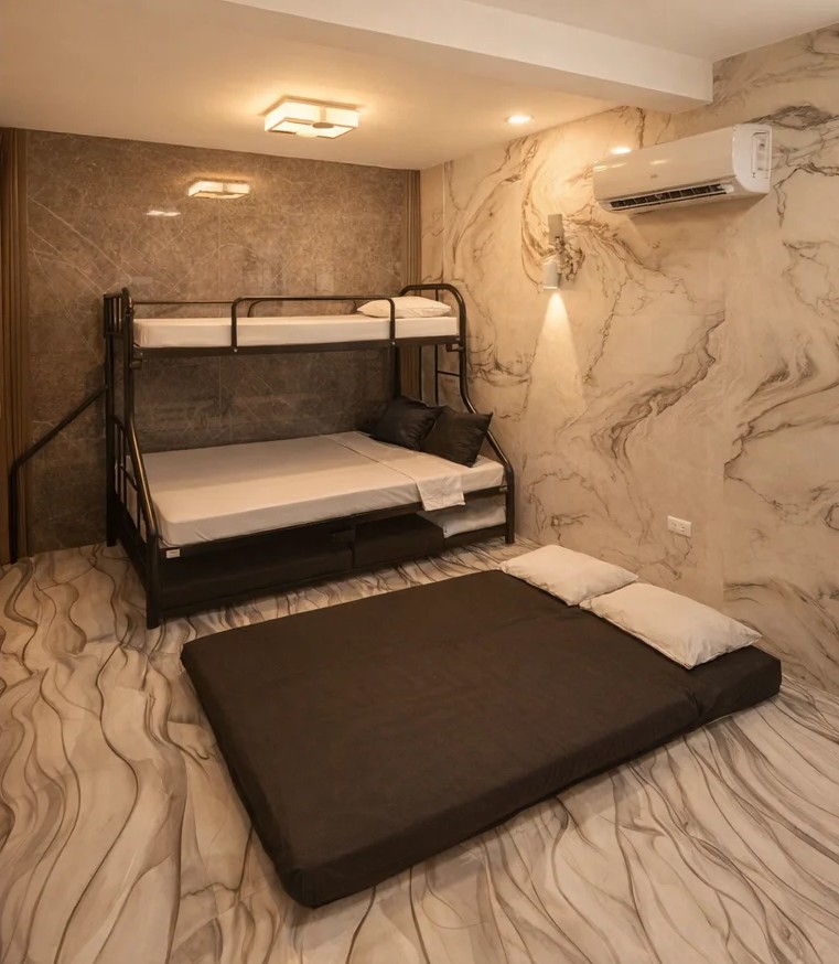Spacious bedroom with bunk bed, floor mattress, and marble interiors